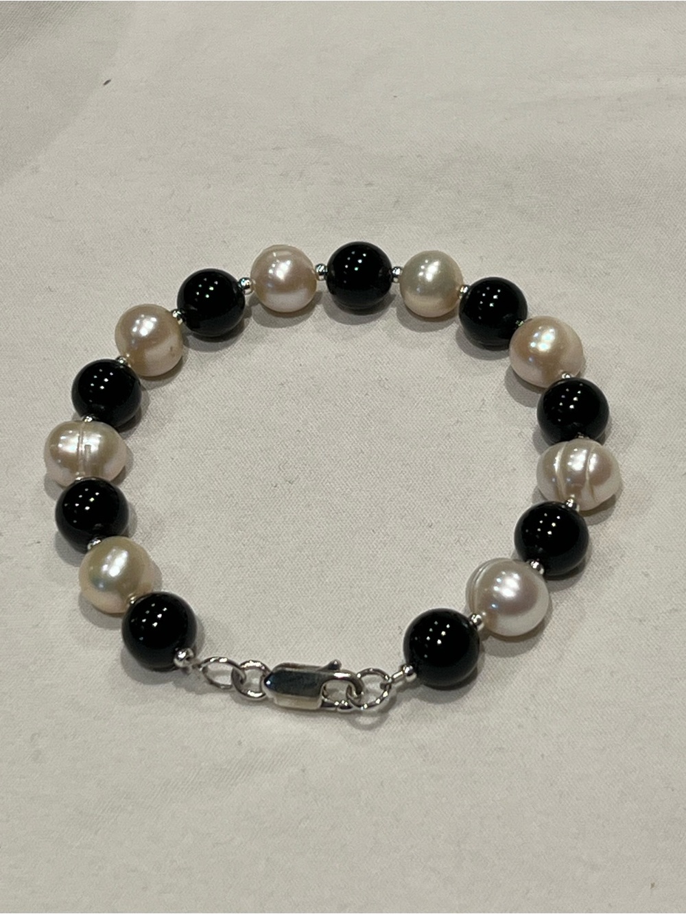 Black onyx and freshwater pearl sterling silver bracelet